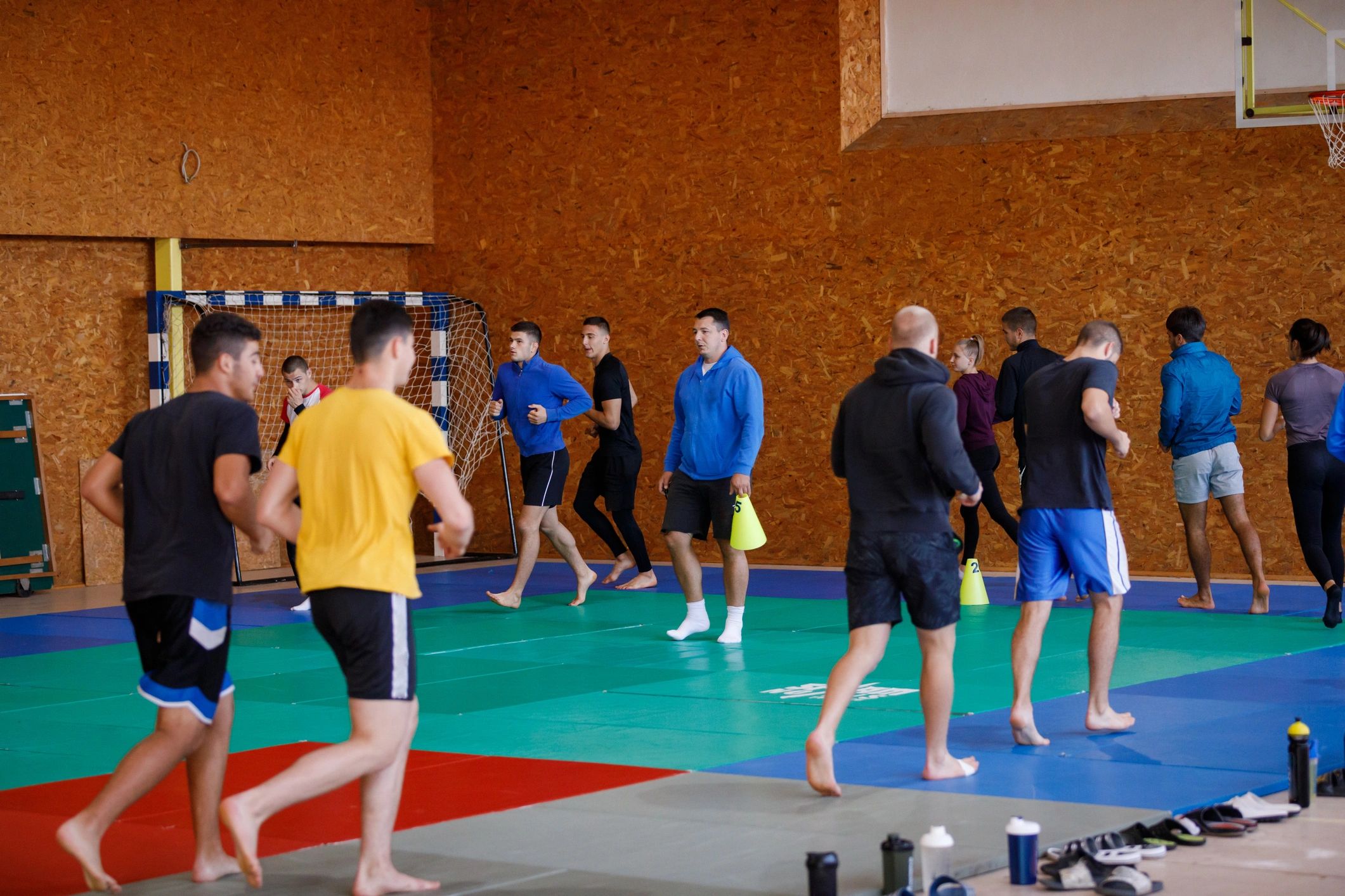 Group warming up before training indoors