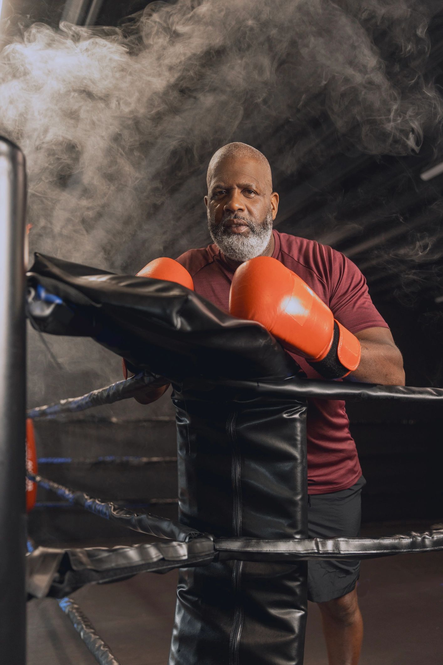 Boxing coach portrait inside the gym